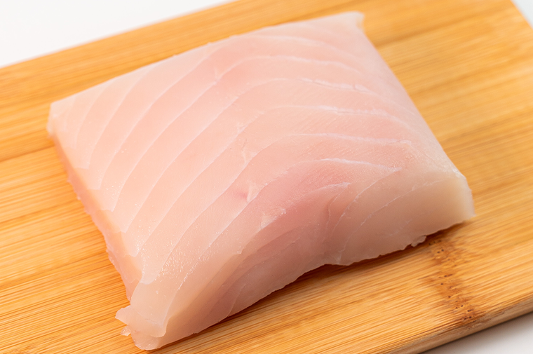 Pacific Dream Seafoods Halibut vacuum pack on cutting board