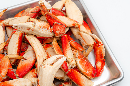 Pacific Dream Seafoods Dungeness crab legs on tray